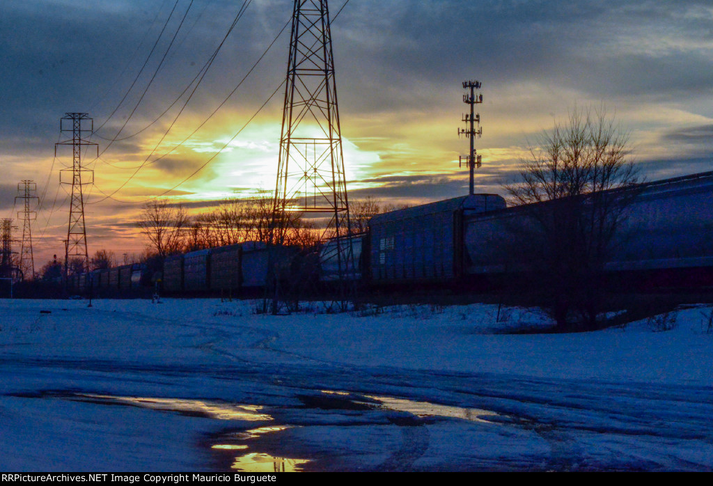 Train passing by at the sunset